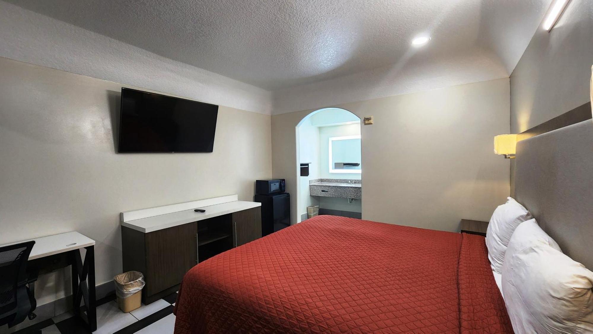 Scottish Inn & Suites Sam Houston Parkway Buitenkant foto